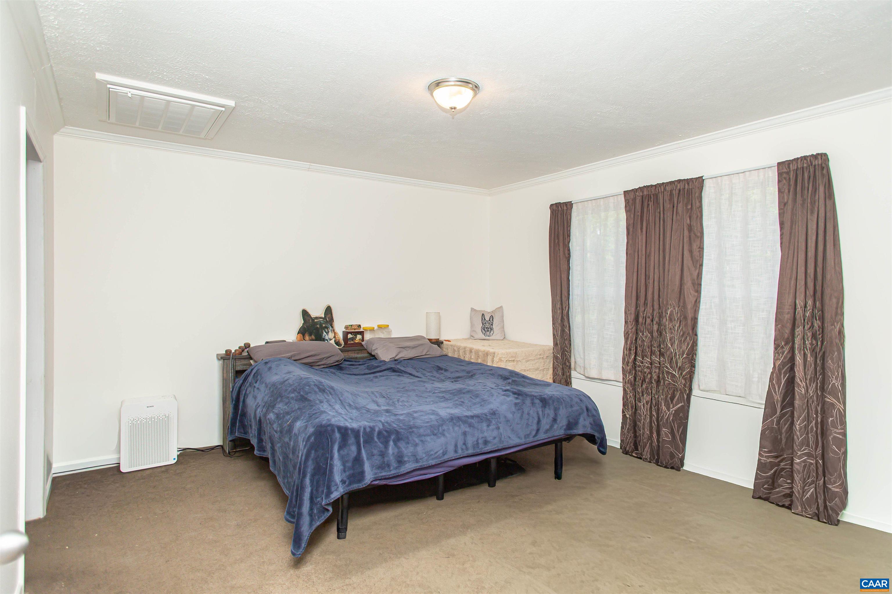 Primary bedroom at the other side of the home.