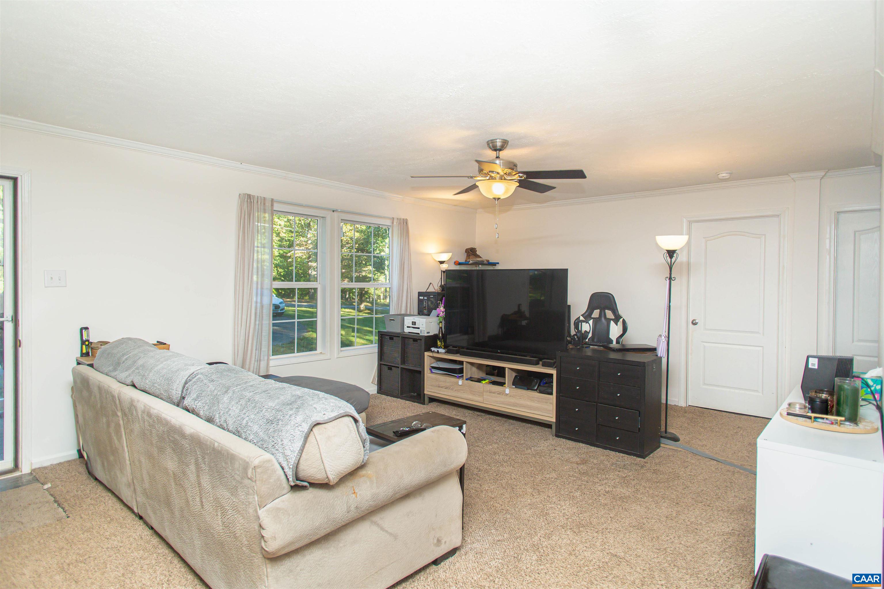 A spacious living room welcomes you into the home.