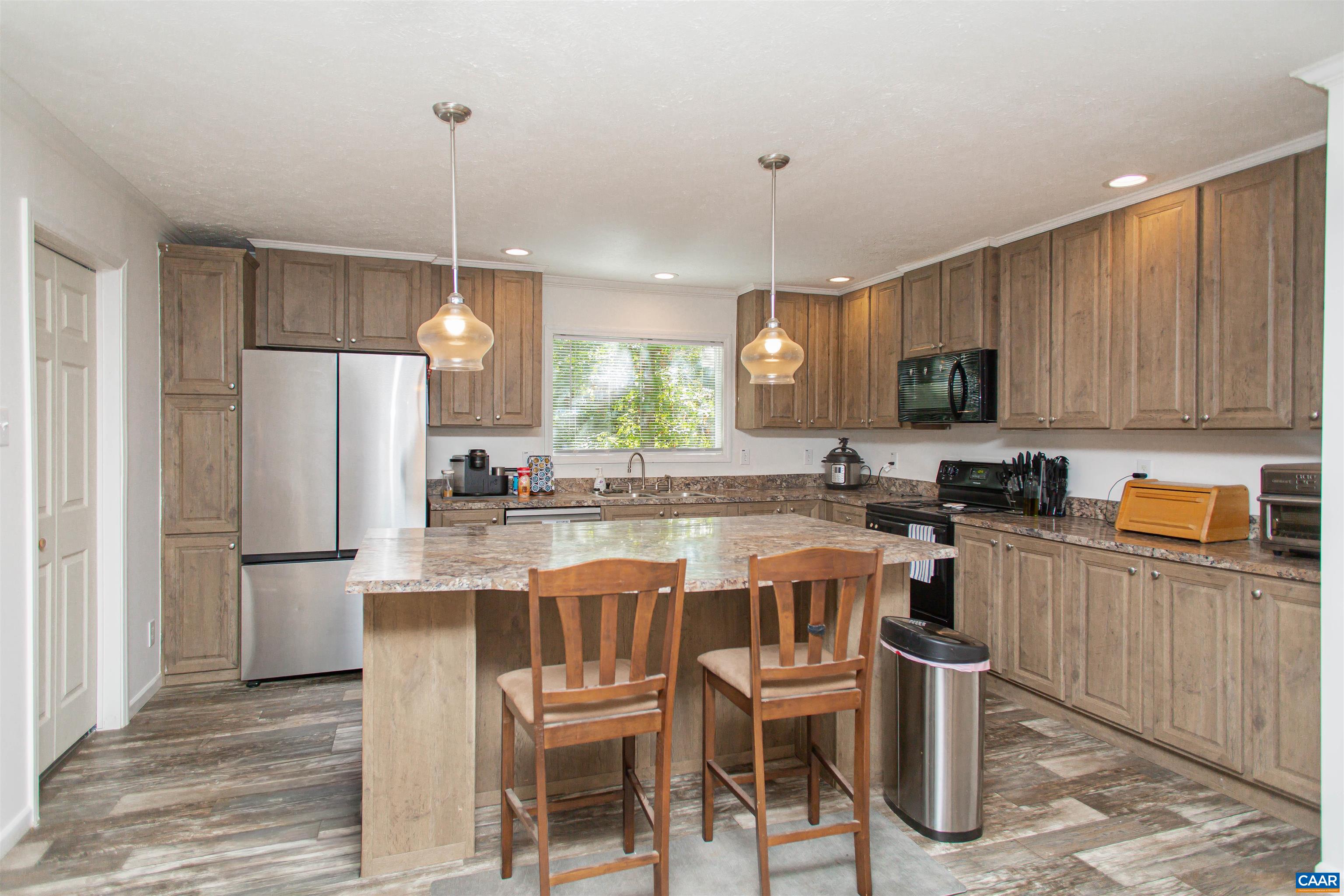 Cabinet-lined eat-in-kitchen.