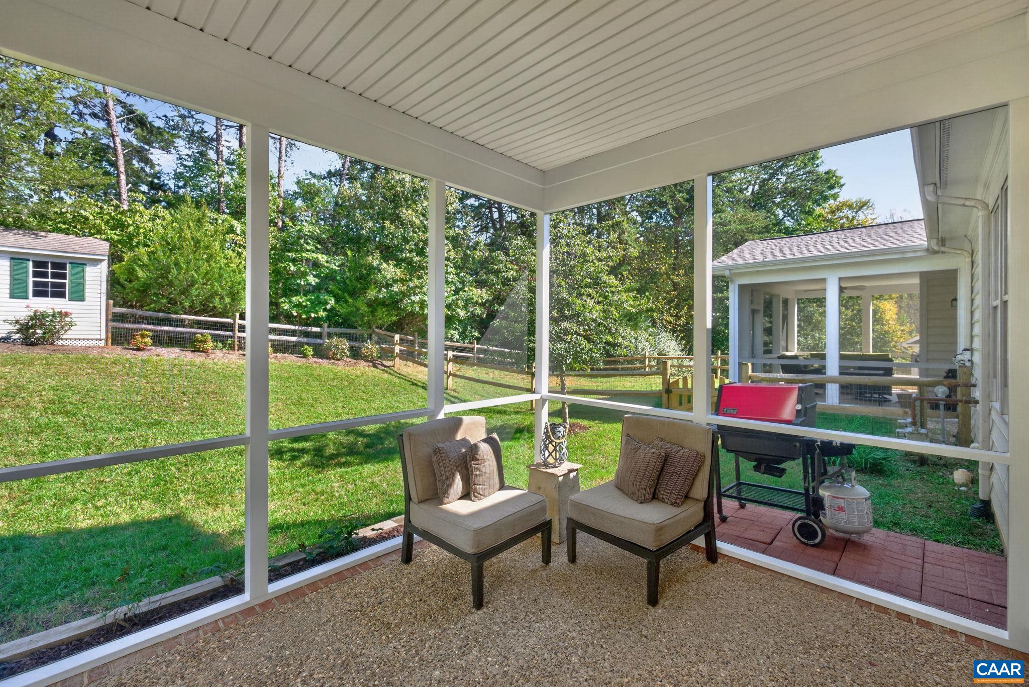 Even rainy days are enjoyable outside thanks to this screened porch overlooking the fenced backyard. Even rainy days are enjoyable outside thanks to this screened porch overlooking the fenced backyard.