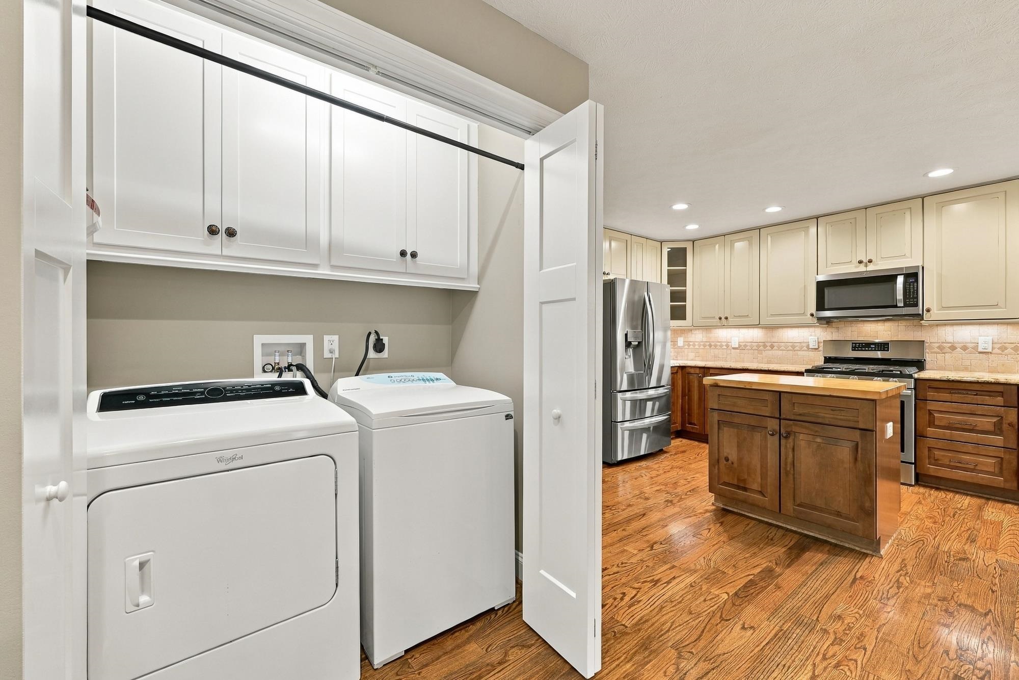 with washer and dryer, cabinets