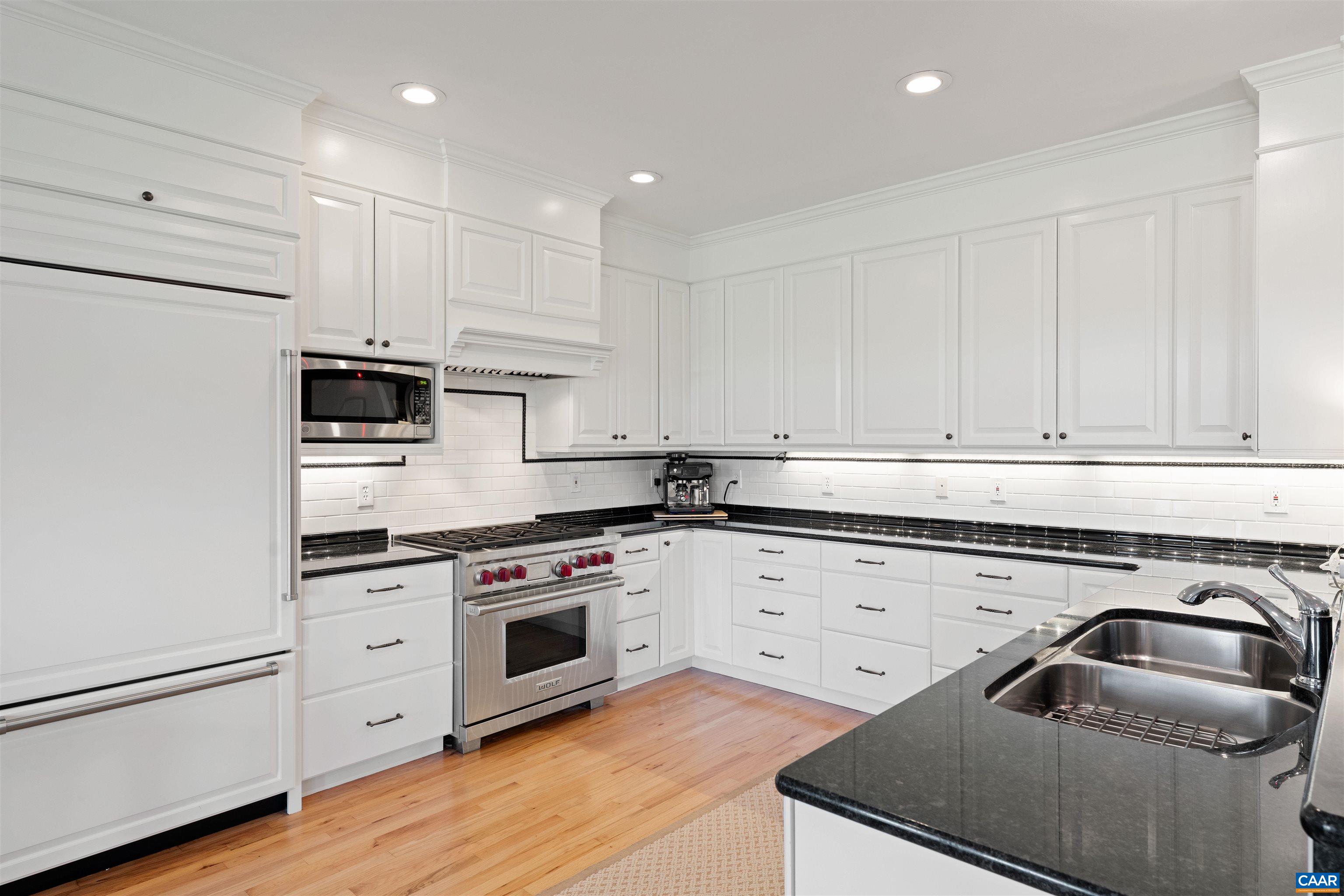 Kitchen renovated in 2013: custom cabinetry, granite counters, Wolf range, Sub-Zero refrigerator and KitchenAid appliances. Kitchen renovated in 2013: custom cabinetry, granite counters, Wolf range, Sub-Zero refrigerator and KitchenAid appliances.