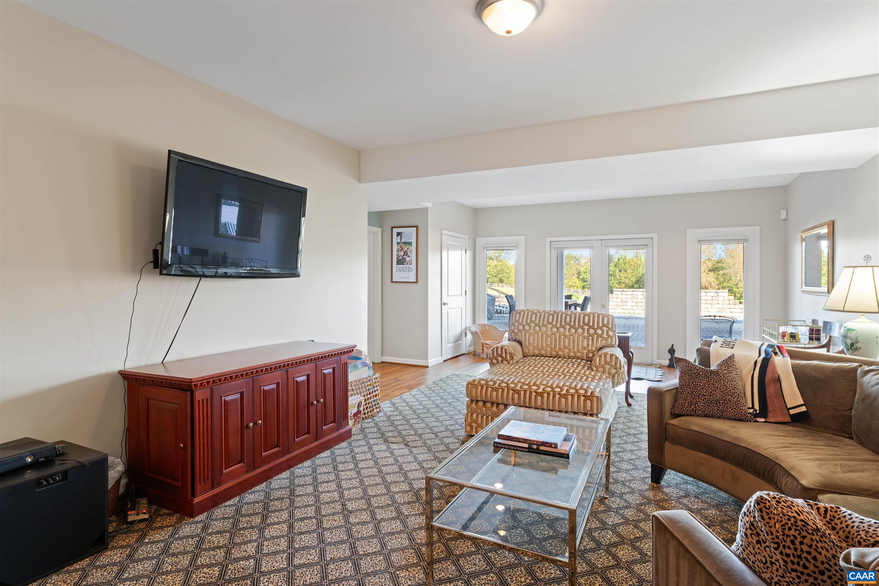 Lower level family room, finished in 2016, with doors to the rear grounds at the walkout. Lower level family room, finished in 2016, with doors to the rear grounds at the walkout.