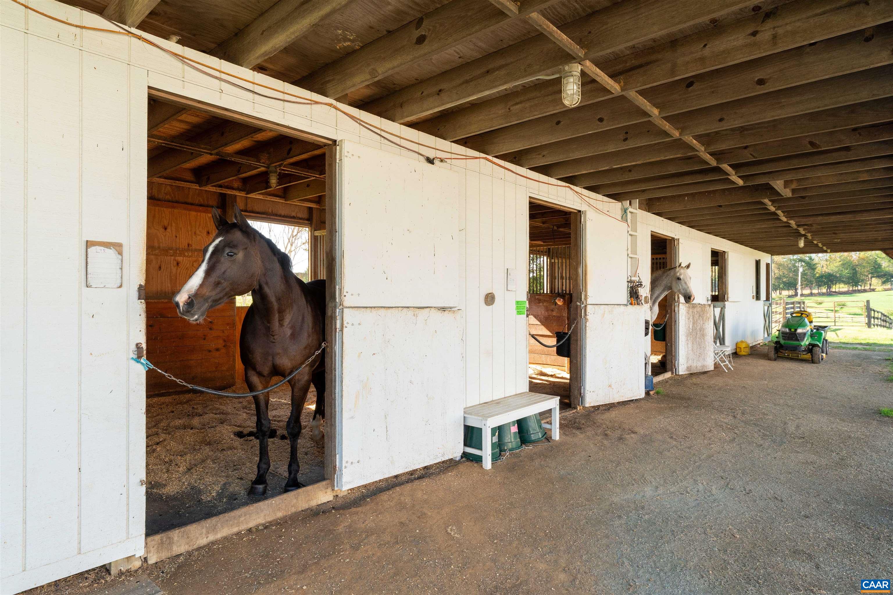 Stalls in the original barn, which also holds an office and tack room. Stalls in the original barn, which also holds an office and tack room.
