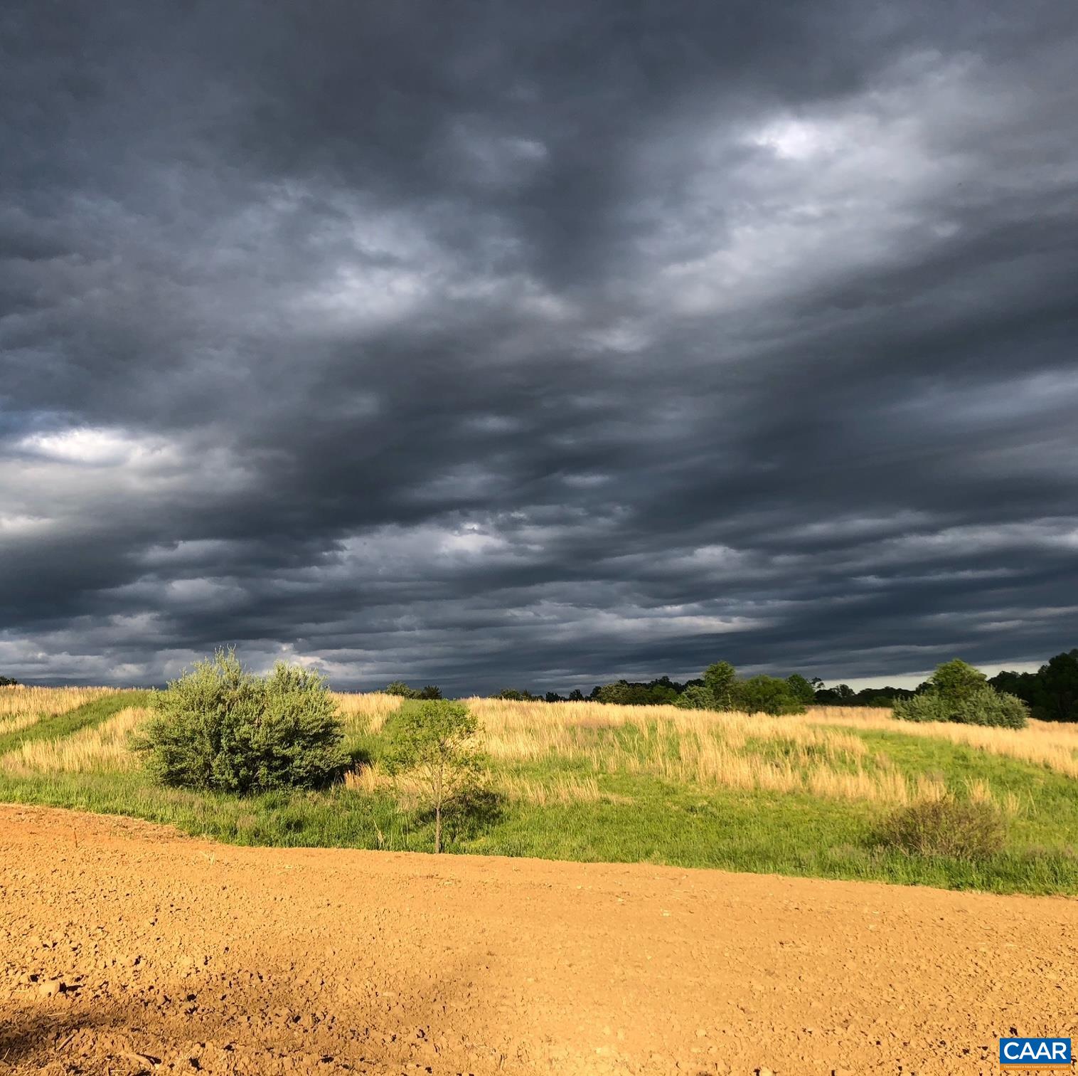 A summer storm building over the open fields. The property in another season. A summer storm building over the open fields. The property in another season.