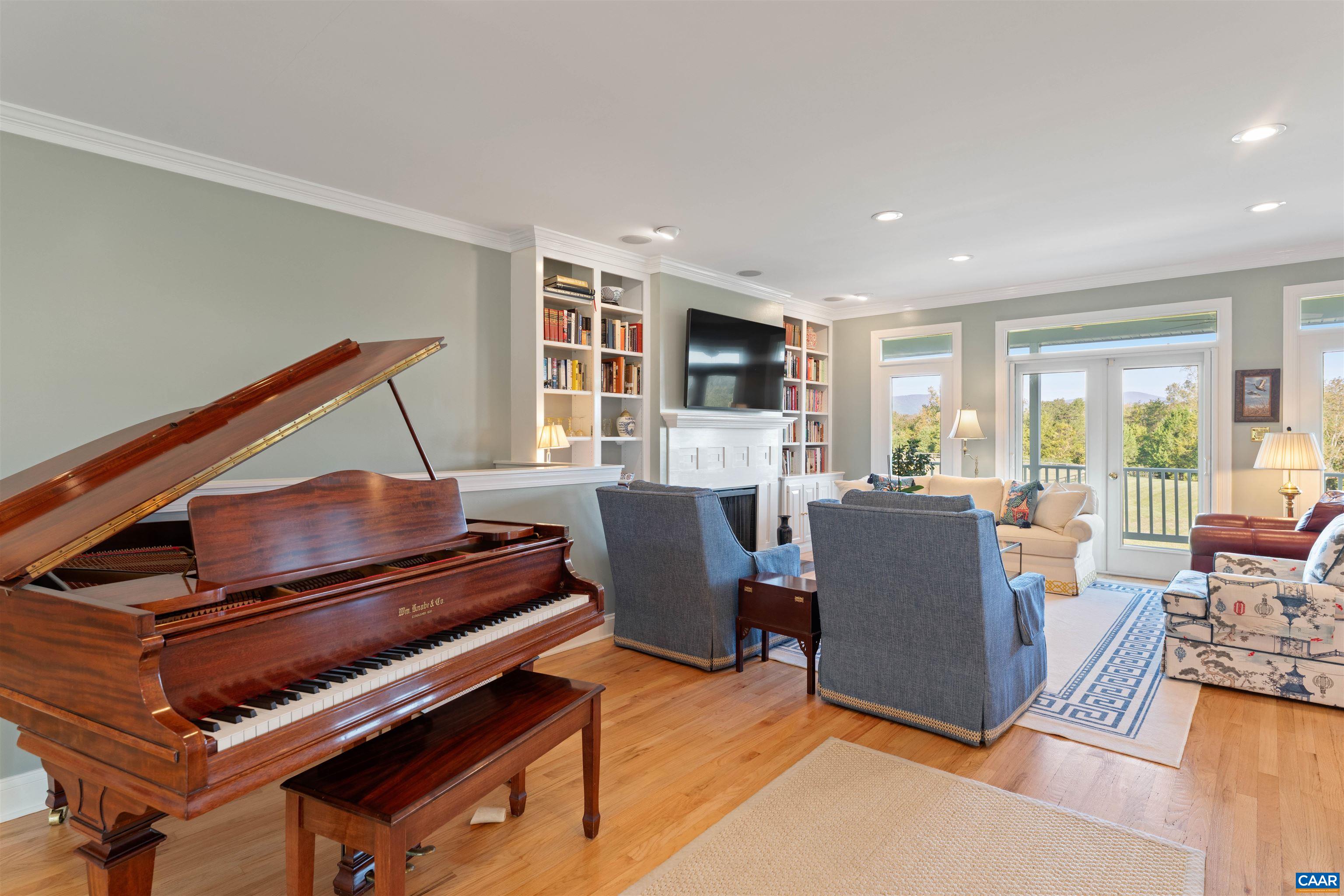 Living room toward the porch, with hardwood floors and room for a grand piano. Living room toward the porch, with hardwood floors and room for a grand piano.
