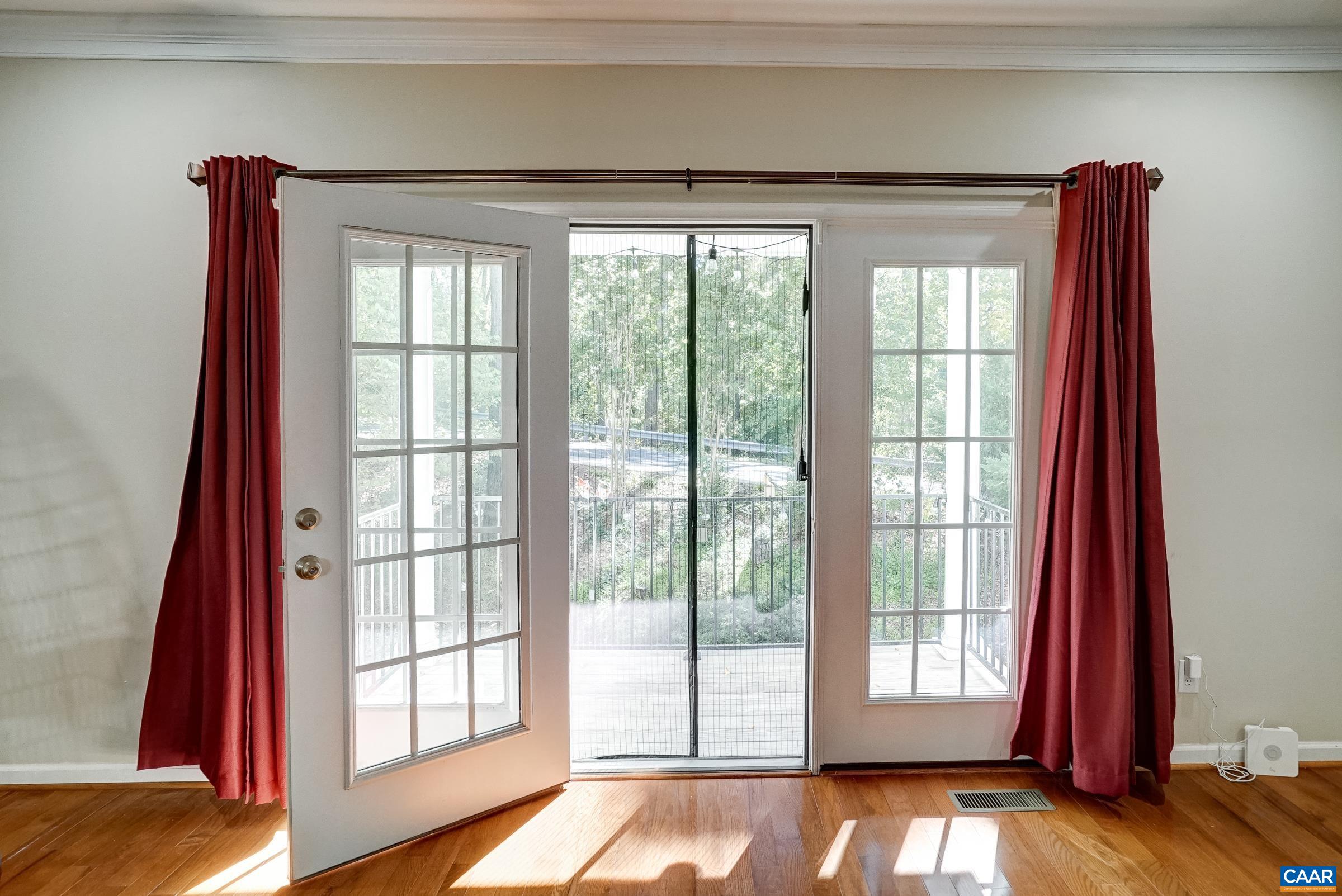 French doors adds lots of natural light; open to quiet deck and green space