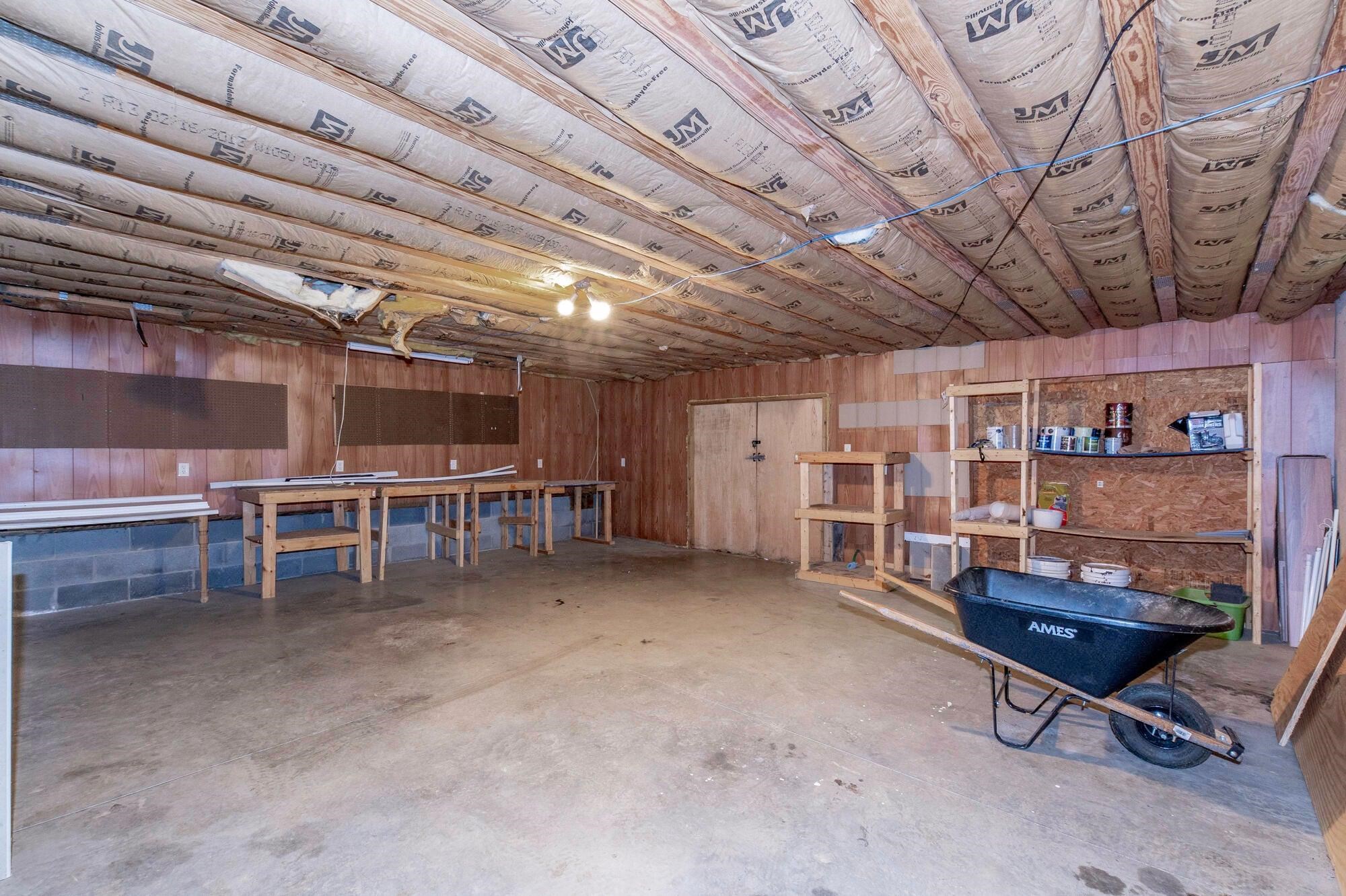 A generous workshop area offers the perfect setting for creative projects, hobbies, or extra storage. A generous workshop area offers the perfect setting for creative projects, hobbies, or extra storage.