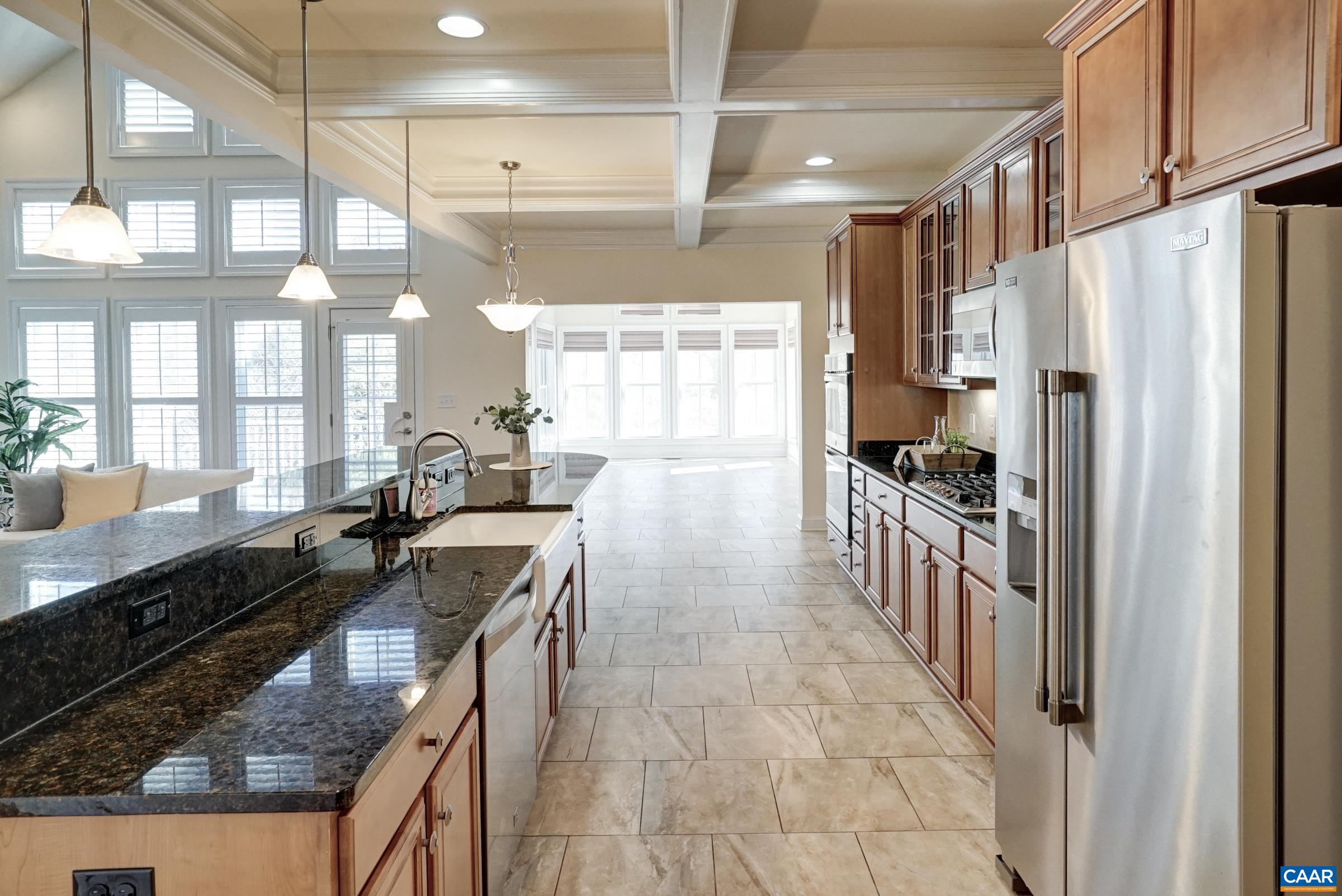 Stainless appliances and coffered ceiling. Stainless appliances and coffered ceiling.