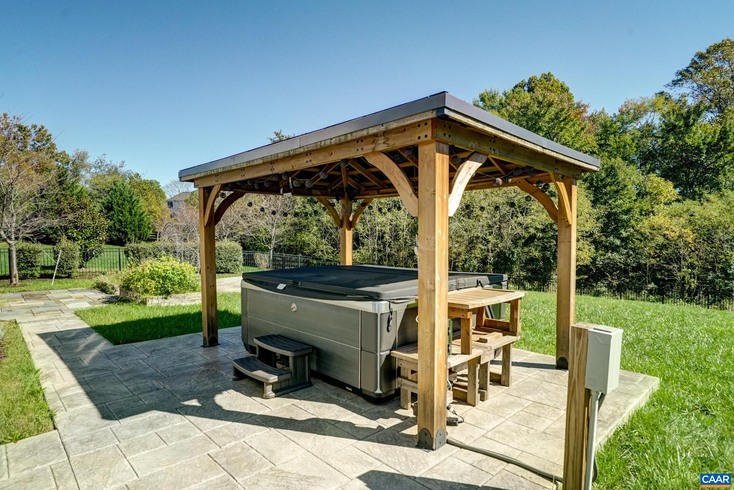 Relax your cares away in the hot tub with shade. Relax your cares away in the hot tub with shade.