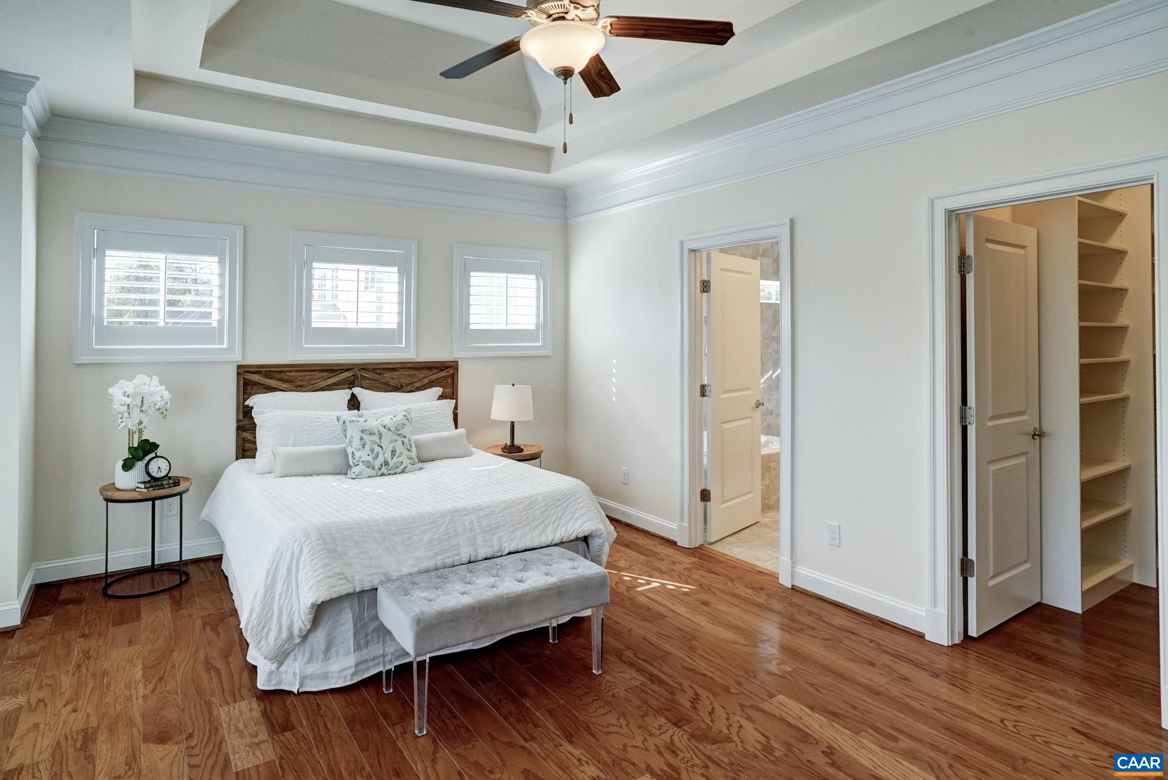 Large walk in closet and ensuite bathroom in the primary suite. Large walk in closet and ensuite bathroom in the primary suite.