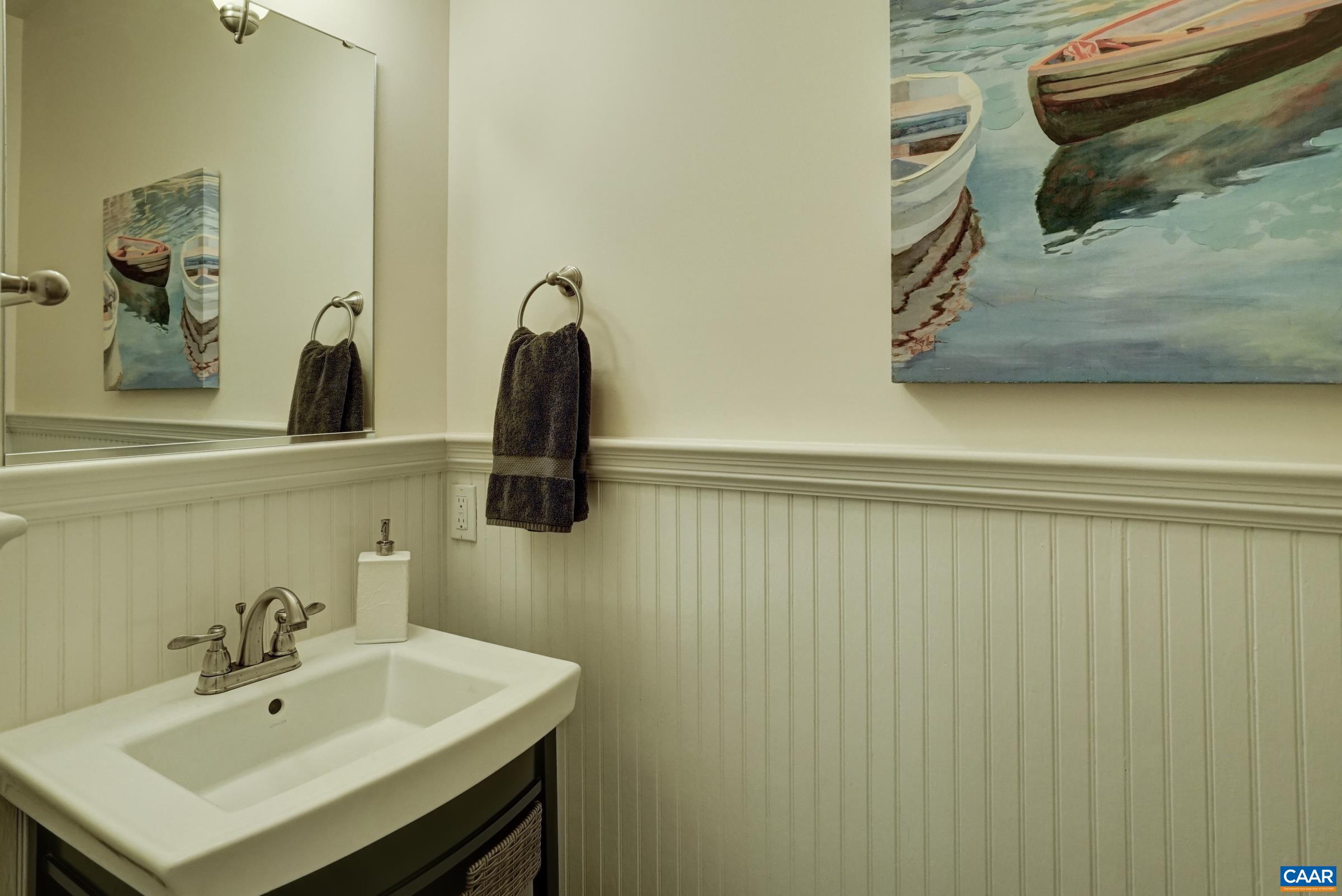 Half bathroom with beadboard wainscoting. Half bathroom with beadboard wainscoting.