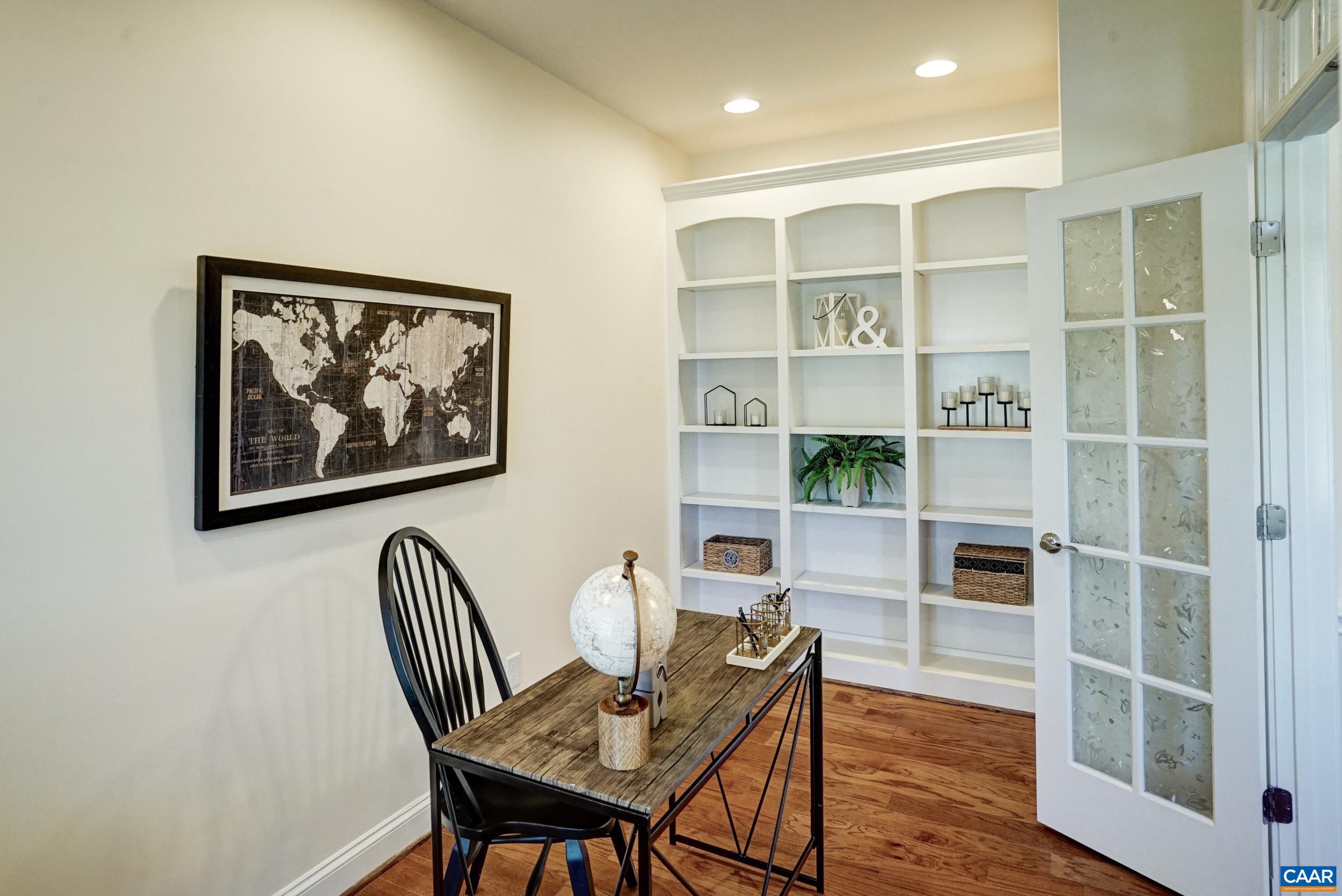 Private home office with french doors and built-in book cases. Private home office with french doors and built-in book cases.