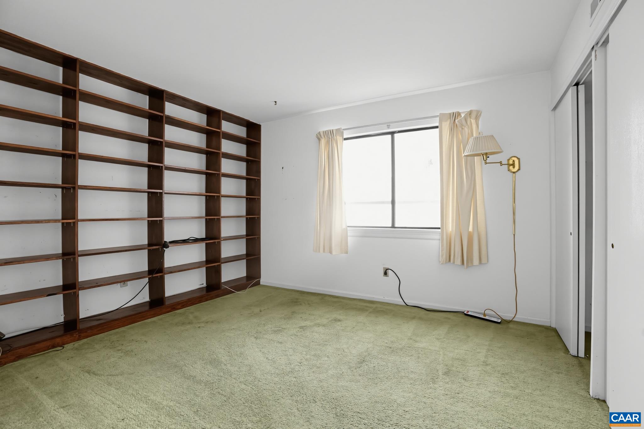 Bedrooom/Den with shelving at one end Bedrooom/Den with shelving at one end