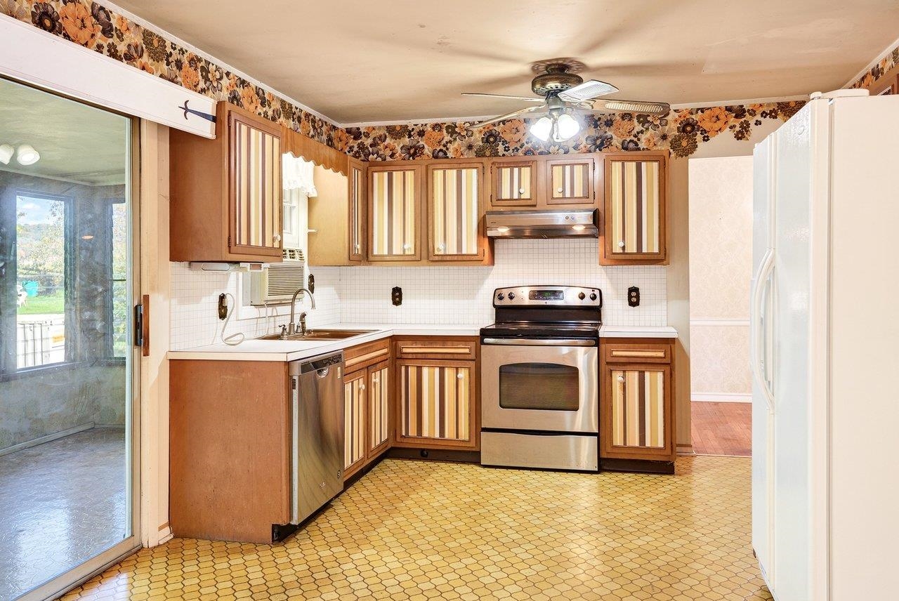 The retro-style kitchen includes appliances and offers plenty of vintage charm.