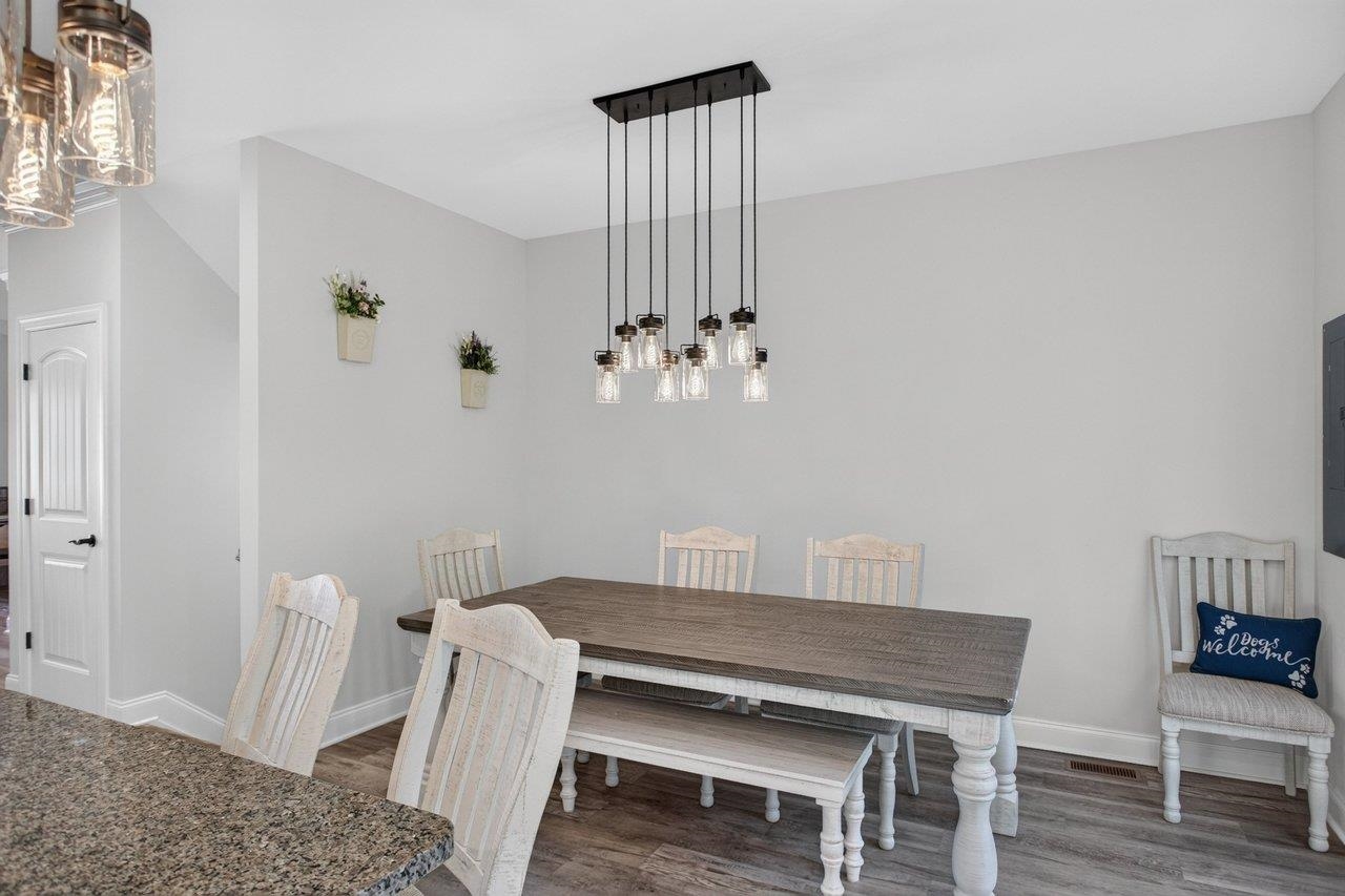 The dining room offers plenty of space for a large table and family gatherings and has easy to care for LVP floors.