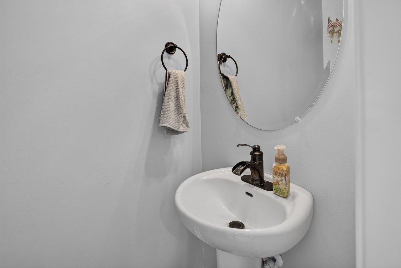 A convenient half bath is located just off the living room.