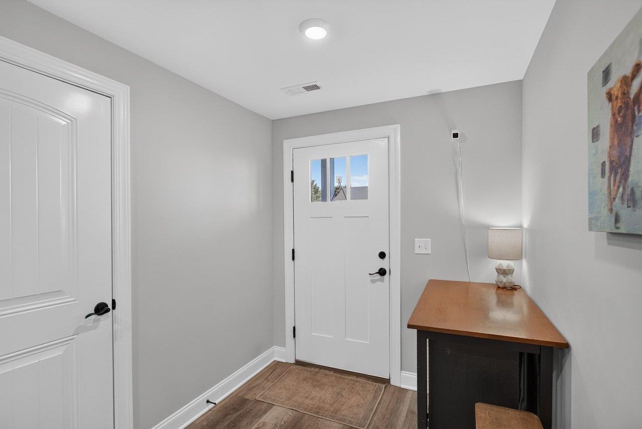 The entry leads to a finished room that could serve as a family room, rec room, or potential 4th bedroom. Great extra space!