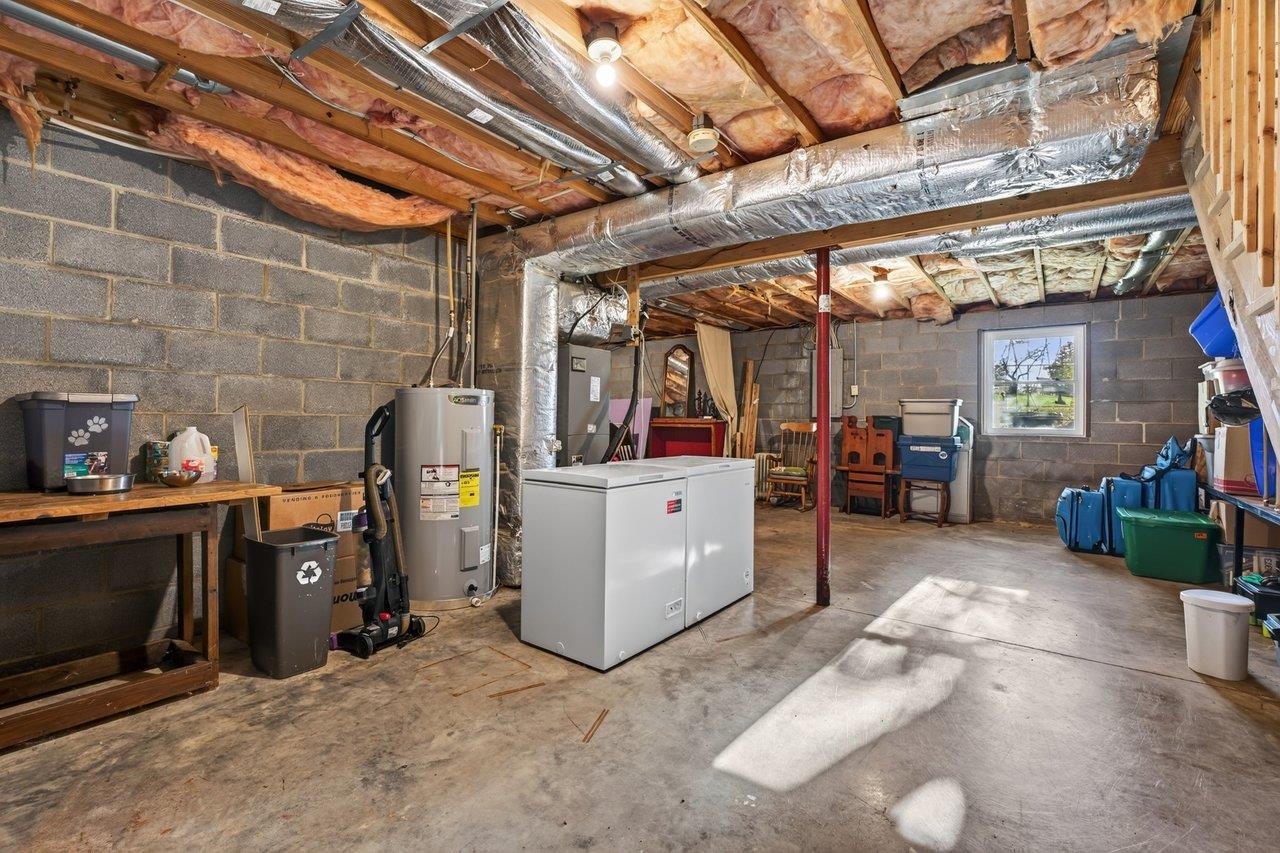 The unfinished basement offers plenty of storage space, room for a workshop, or the potential to finish for additional living space.