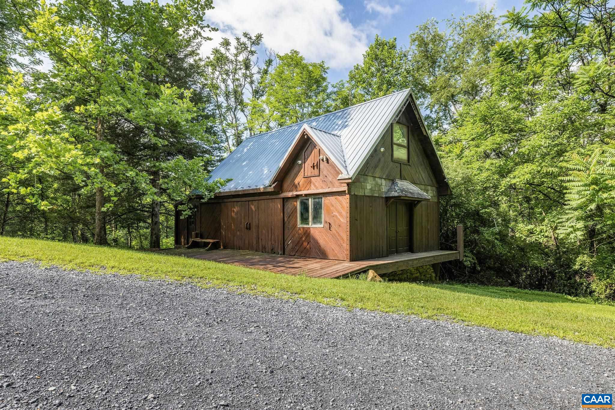 This charming and very solid barn is on the acreage with the existing home, built with reclaimed wood from late 1800s SC mill.