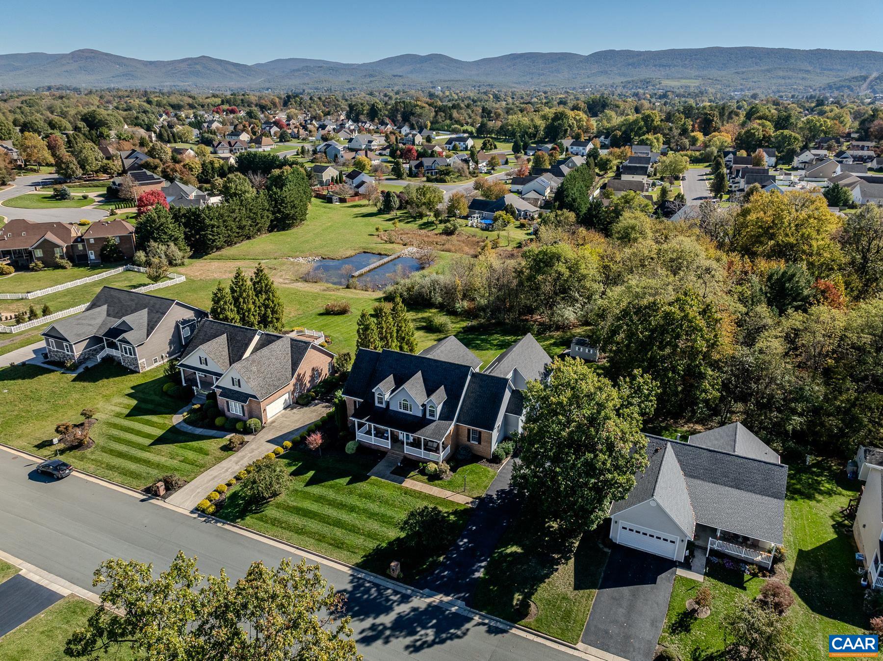 Half acre lot backs to wooded common area with pond and mountain views. Half acre lot backs to wooded common area with pond and mountain views.