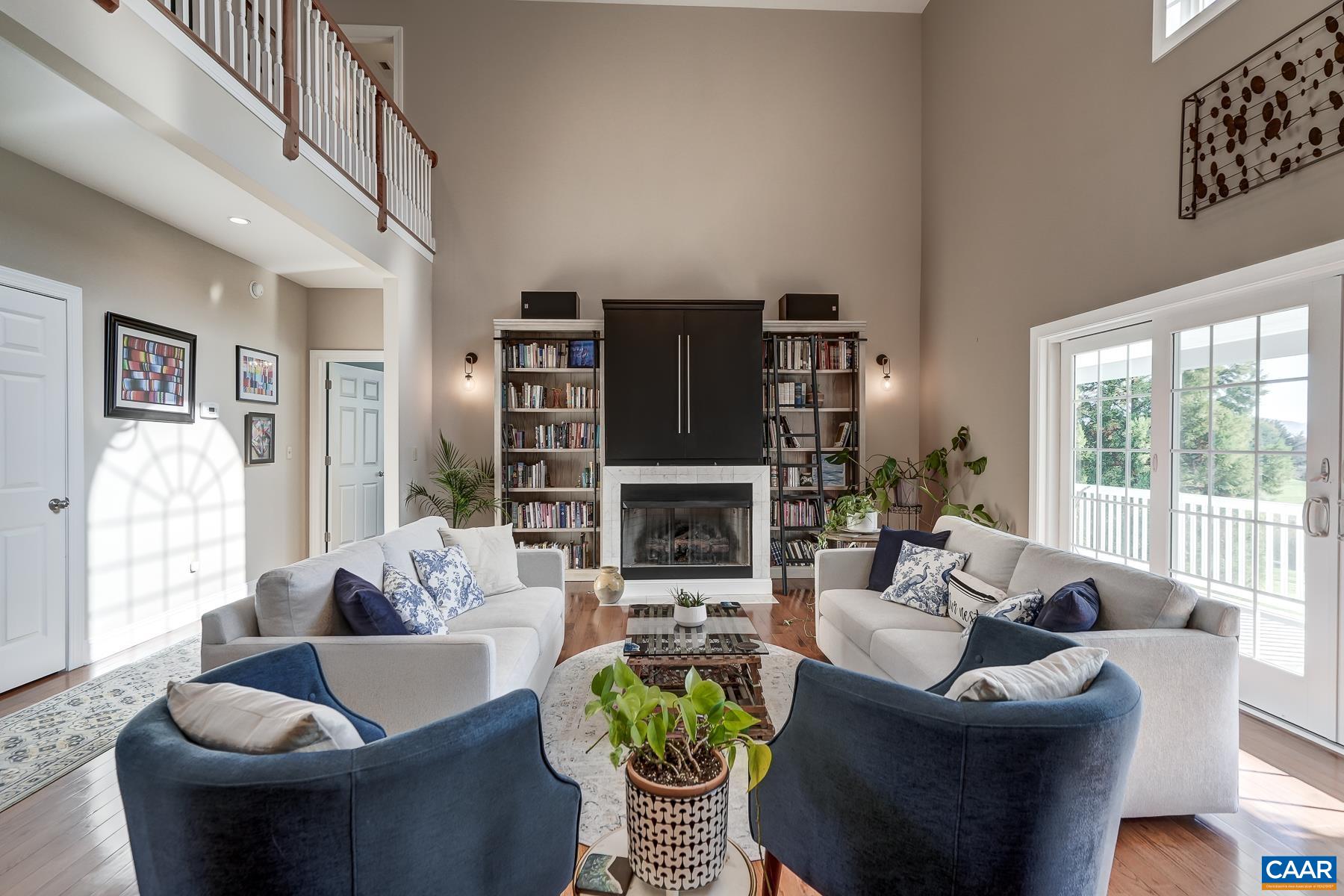 Gas fireplace with TV cabinet above and sconce lighitng. Gas fireplace with TV cabinet above and sconce lighitng.