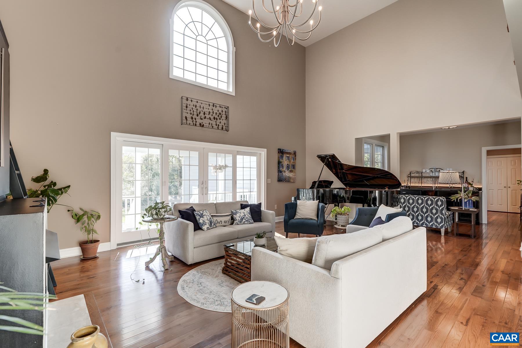 Modern farmhouse chandelier in great room. Modern farmhouse chandelier in great room.