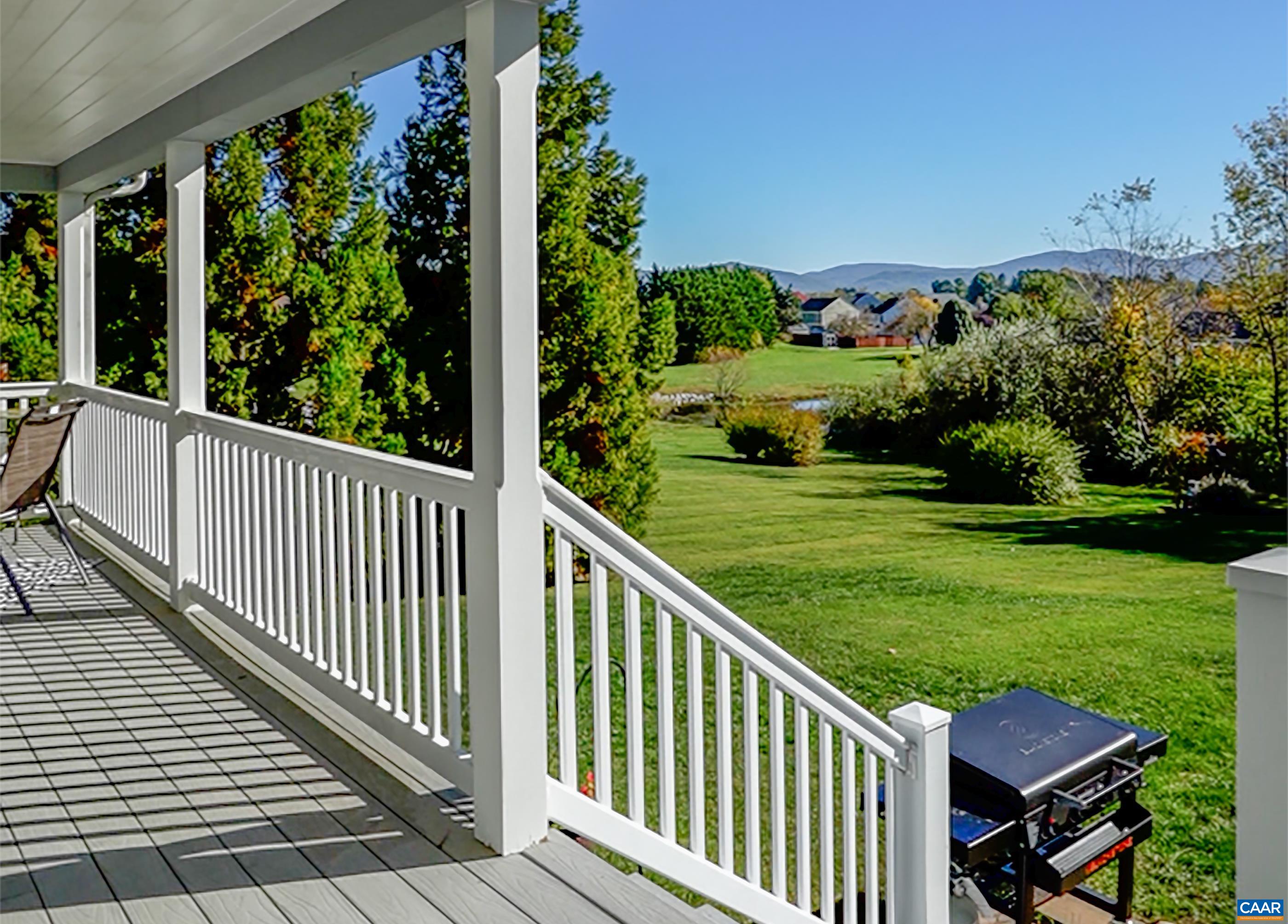 Composite covered rear deck leads to patio for grilling. Composite covered rear deck leads to patio for grilling.