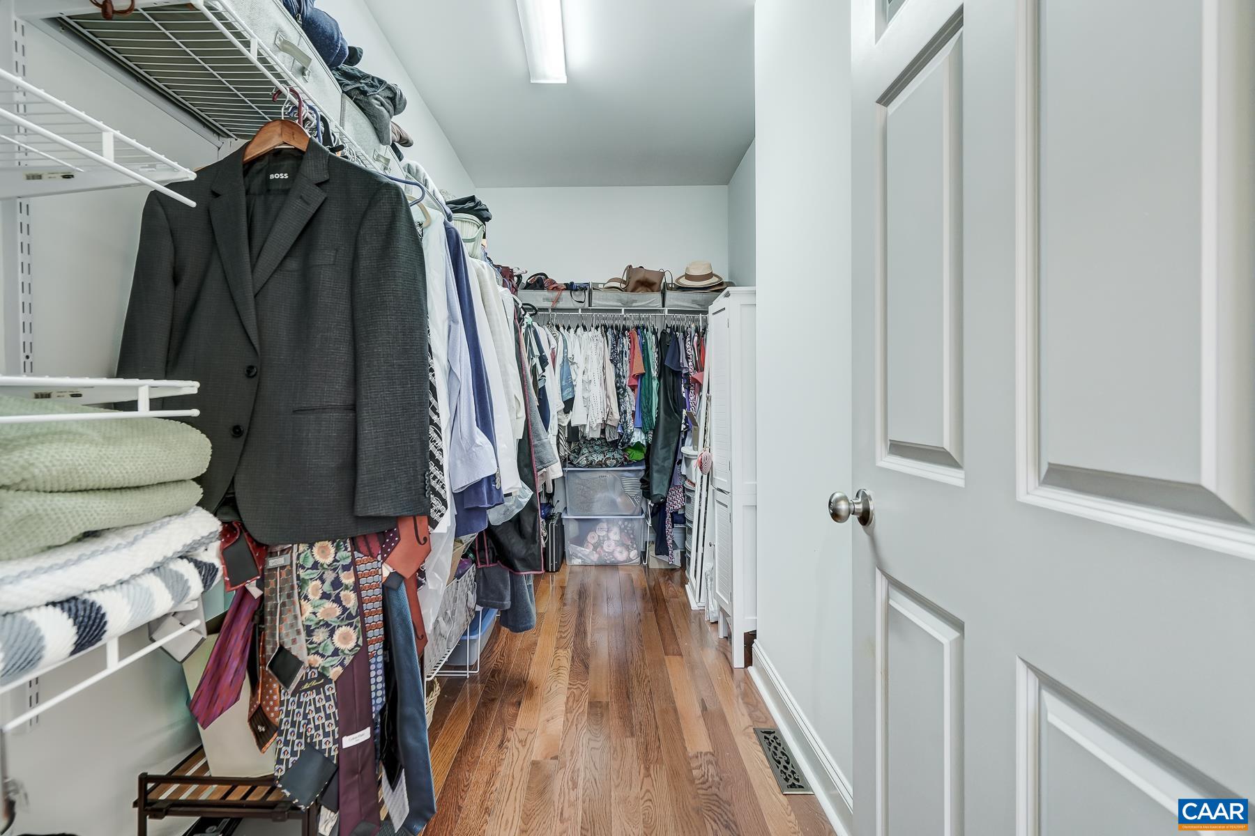 Spacious walk-in closet. Spacious walk-in closet.