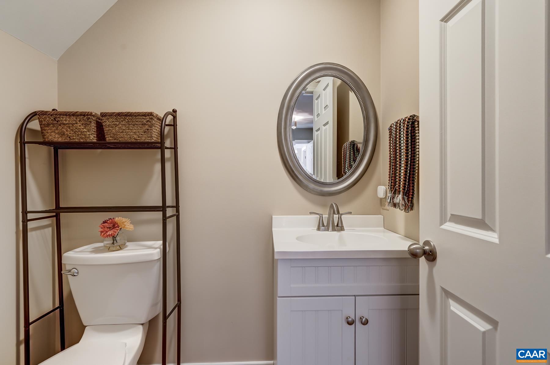 Half bathroom on in guest suite. Half bathroom on in guest suite.