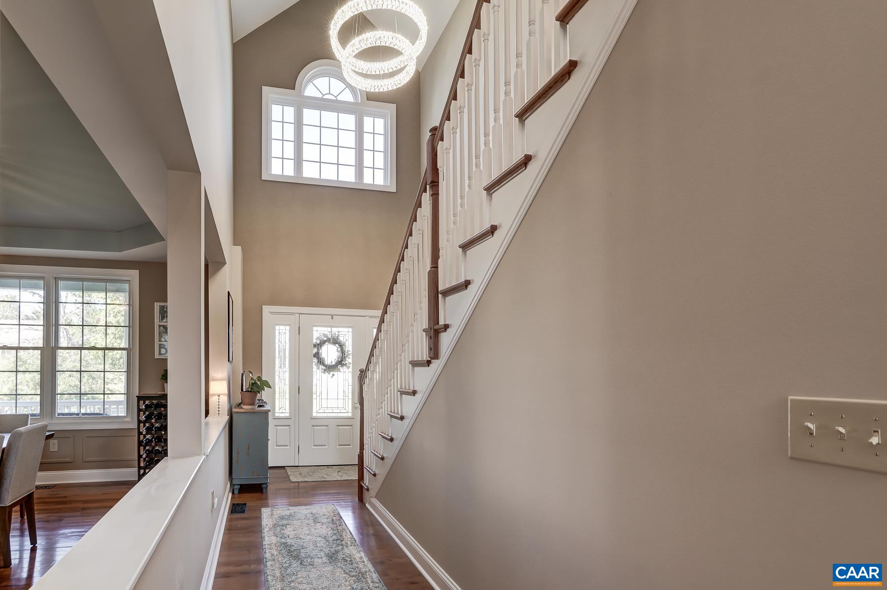 Two story foyer with modern lighting. Two story foyer with modern lighting.