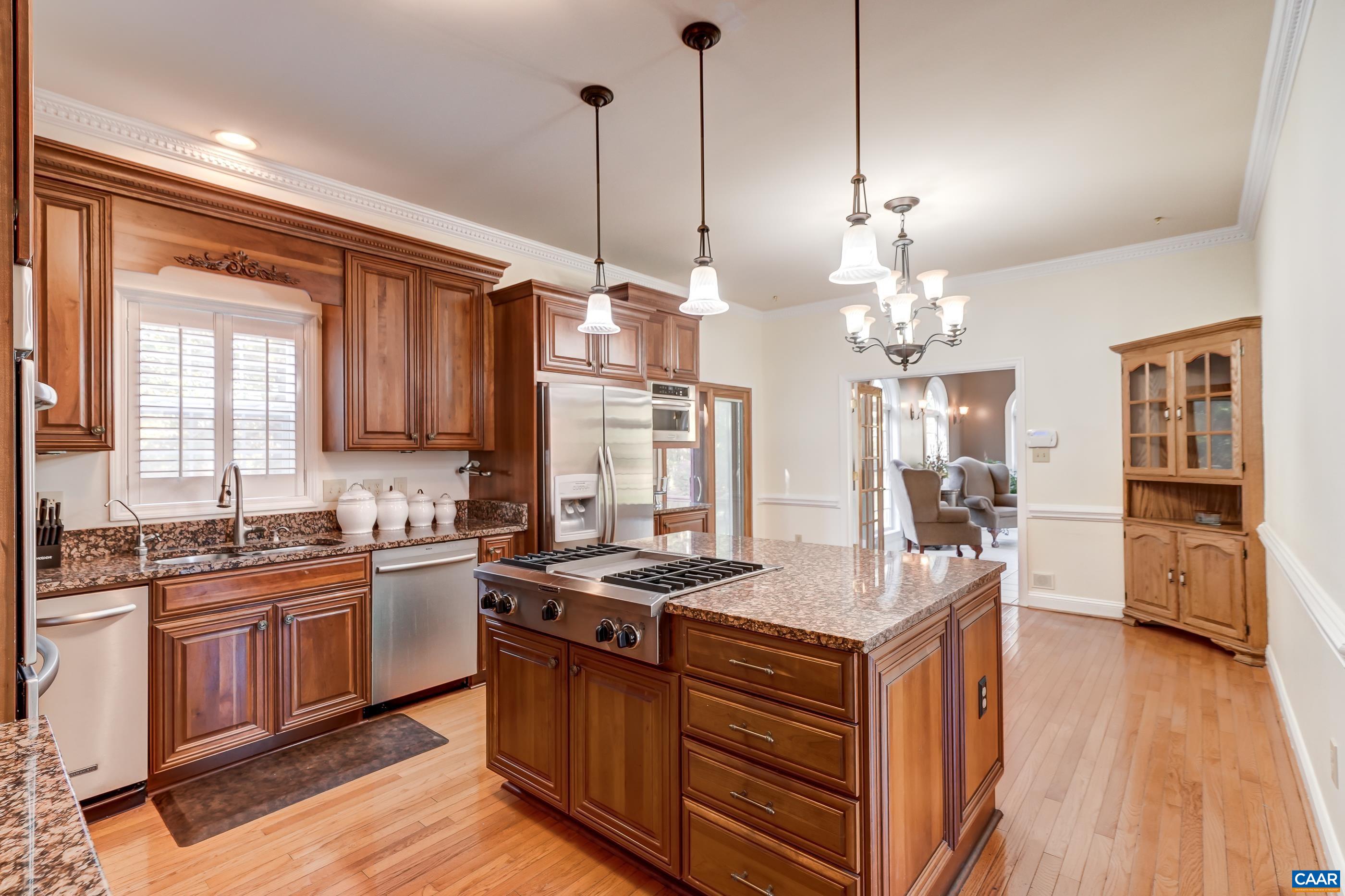 Updated kitchen features cherry cabinets with granite countertops. Updated kitchen features cherry cabinets with granite countertops.