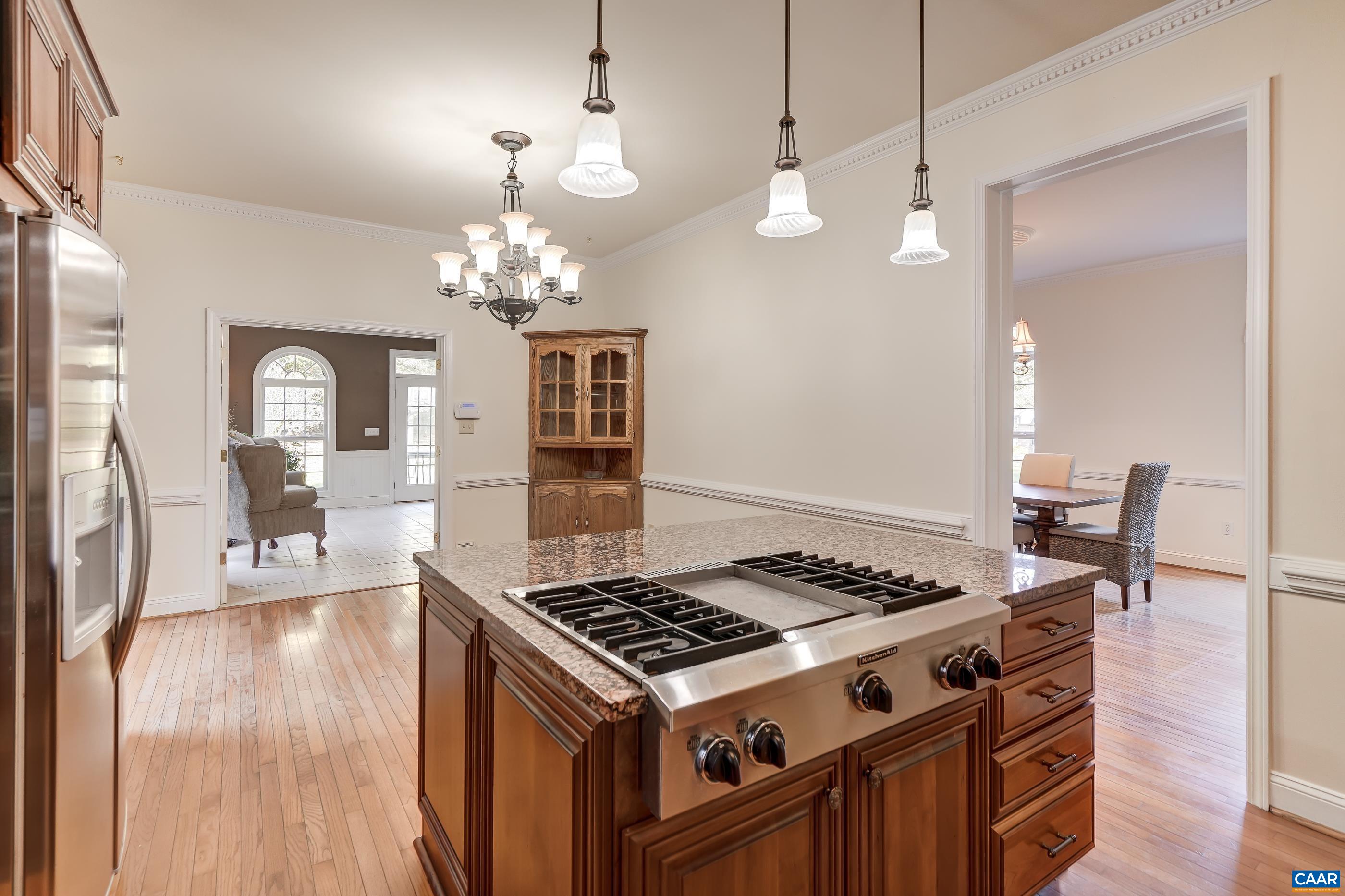 Large island with gas cooktop. Large island with gas cooktop.