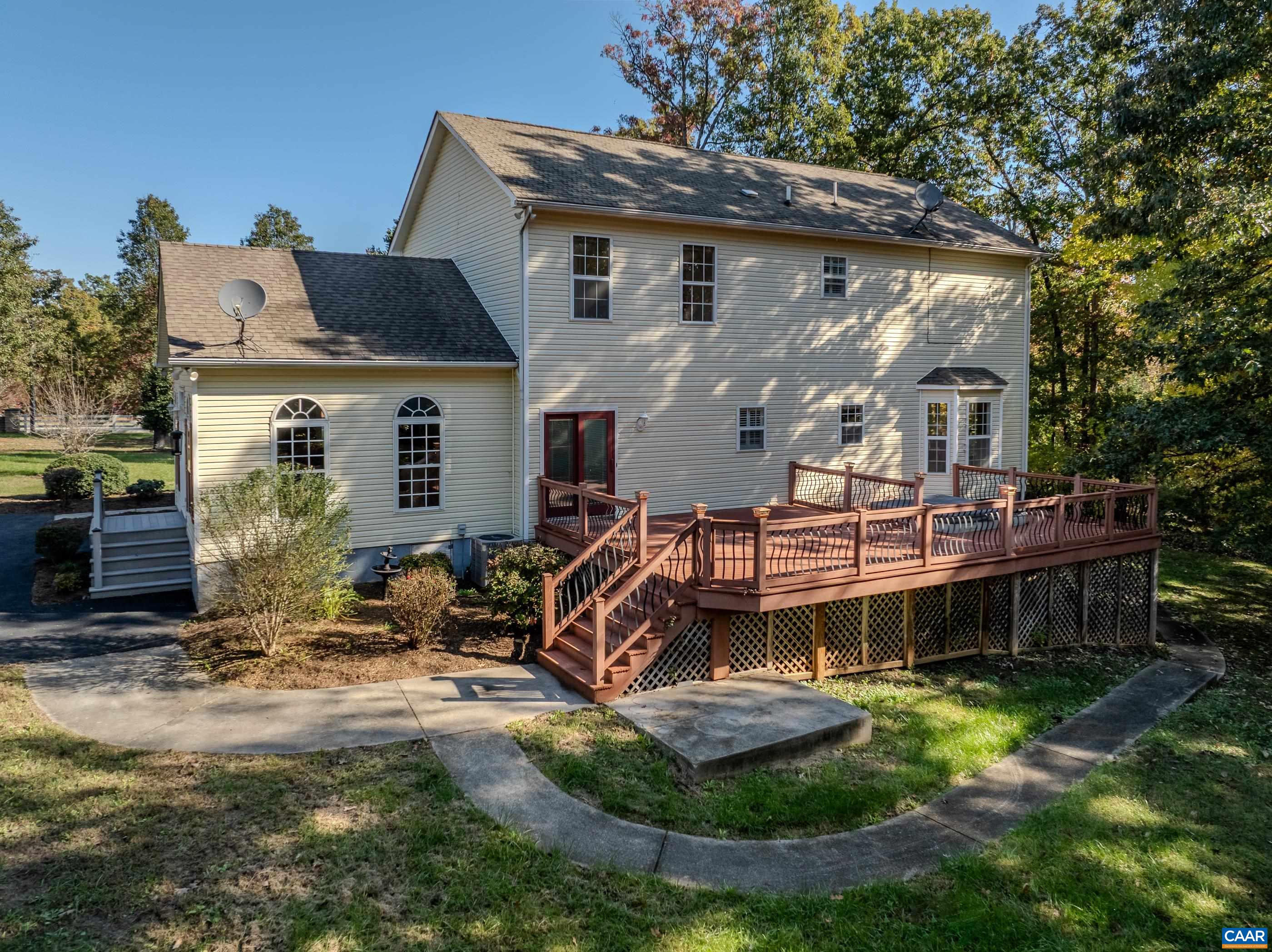 Enjoy outdoor entertaining on the spacious composite deck with sunken hot tub. Enjoy outdoor entertaining on the spacious composite deck with sunken hot tub.