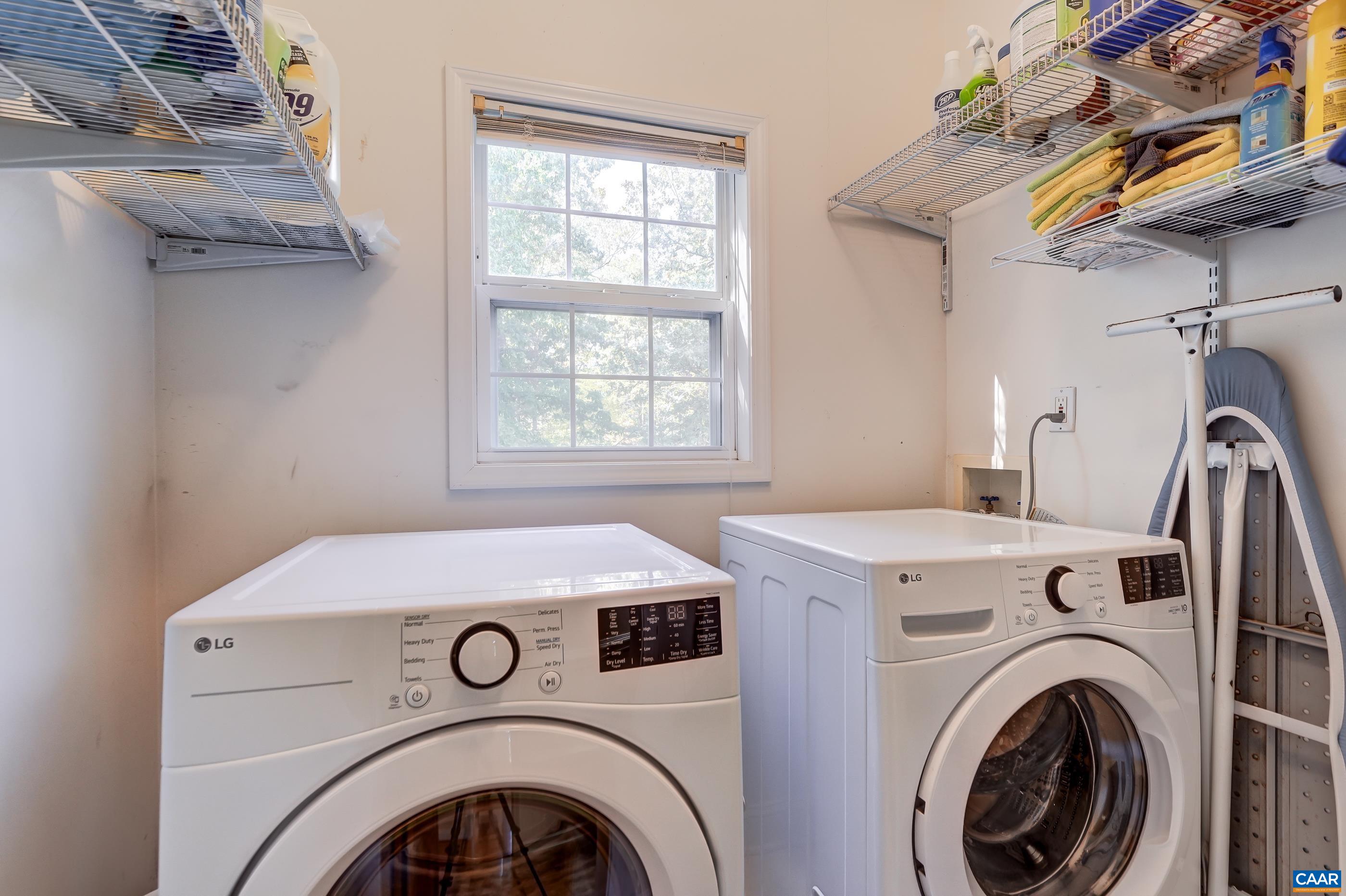 Main level laundry room features new washer and dryer Main level laundry room features new washer and dryer