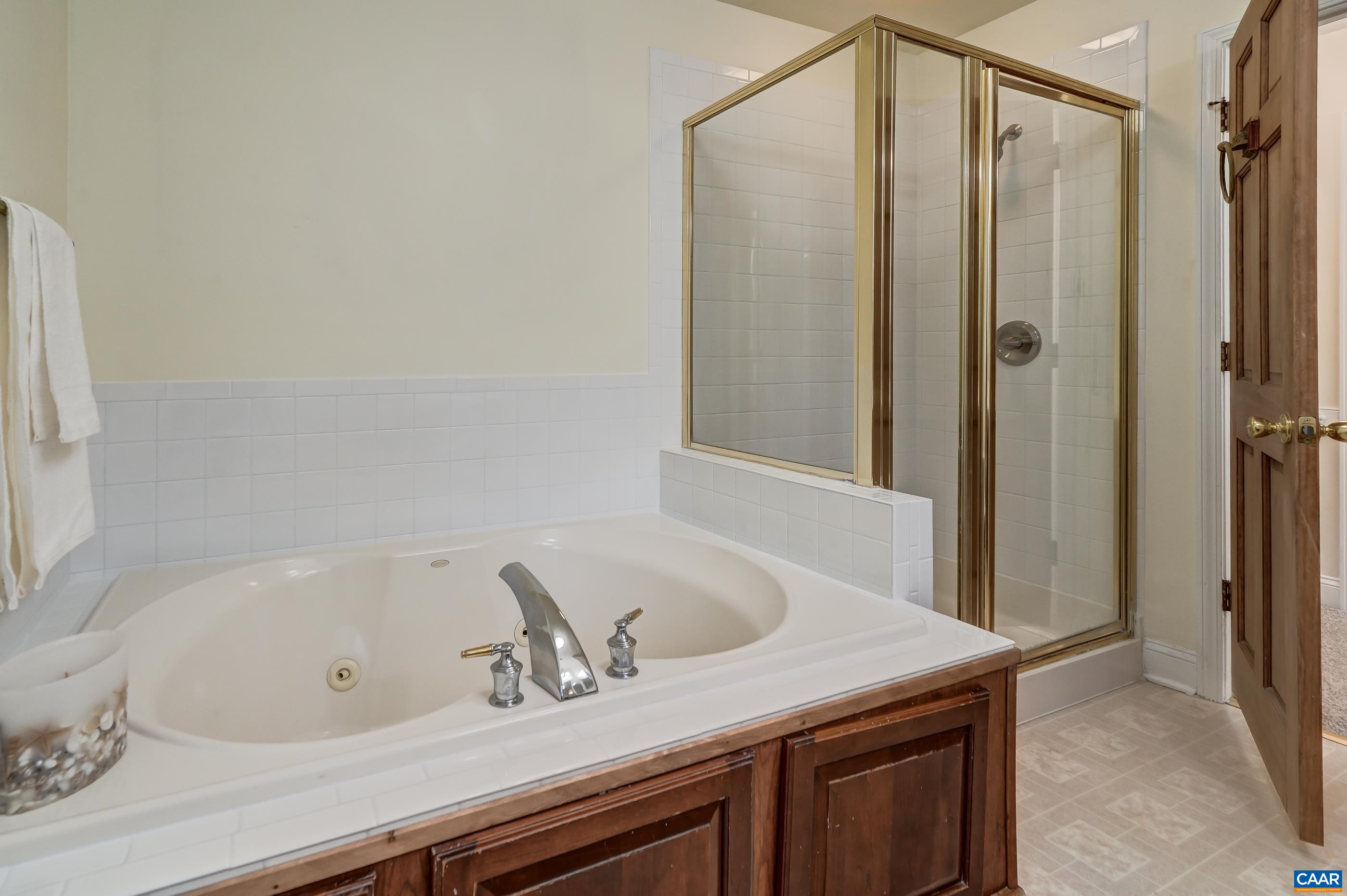 Jetted soaking tub and shower with new tile. Jetted soaking tub and shower with new tile.