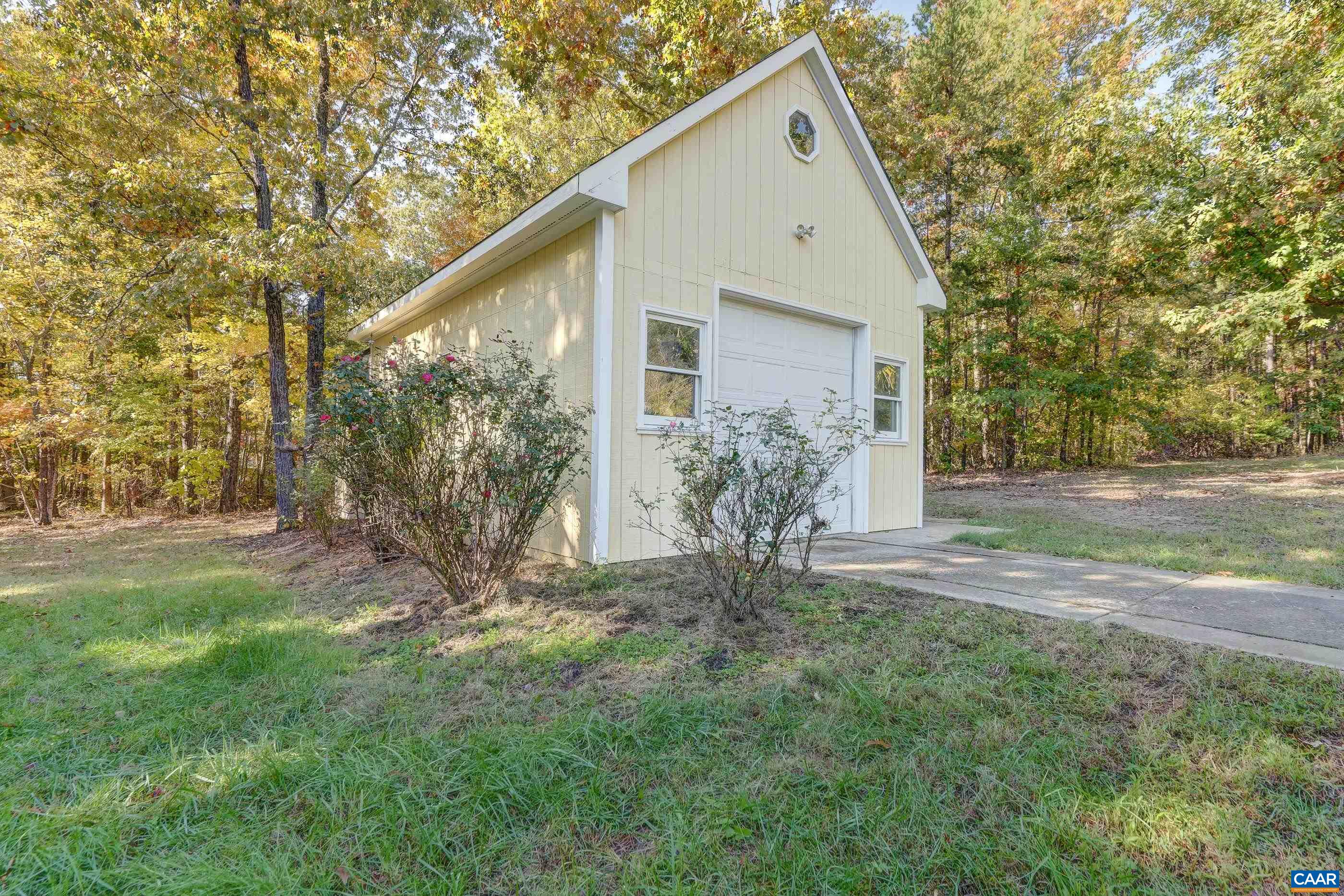 Detached one-car garage with storage area at rear. Detached one-car garage with storage area at rear.
