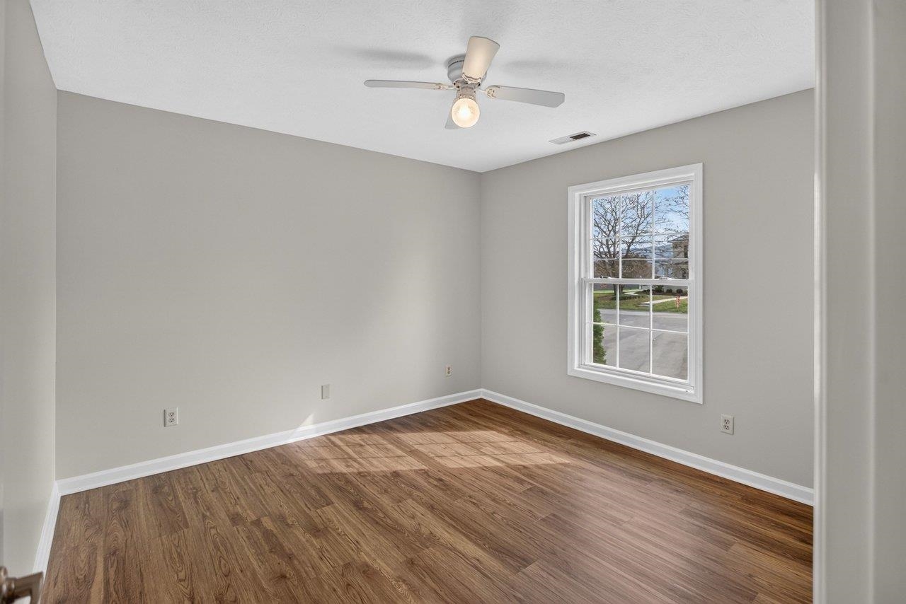 The second bedroom features LVP flooring and a ceiling fan for added comfort. The second bedroom features LVP flooring and a ceiling fan for added comfort.